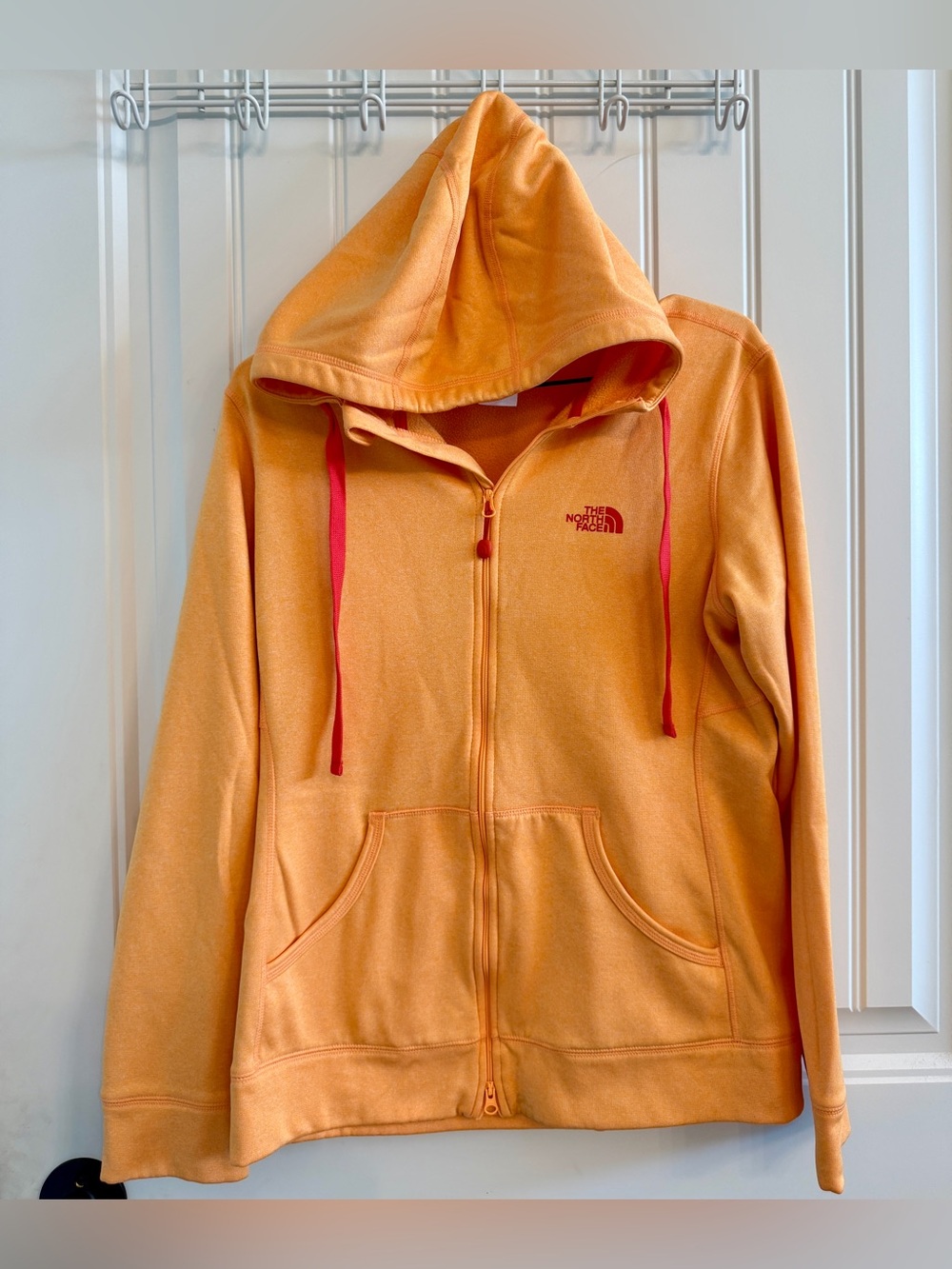 The North Face Orange full Zip Up Hoodie size women’s medium.